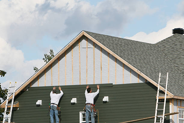 Professional Storm Damage Siding Repair technician working in Burton, OH